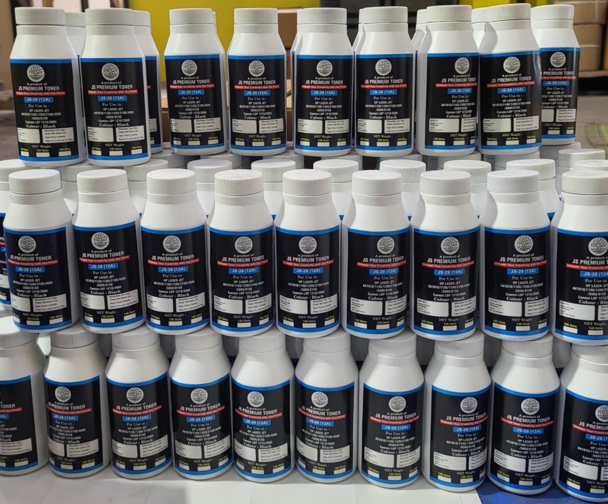 Rows of JS Premium Toner bottles stacked for dispatch